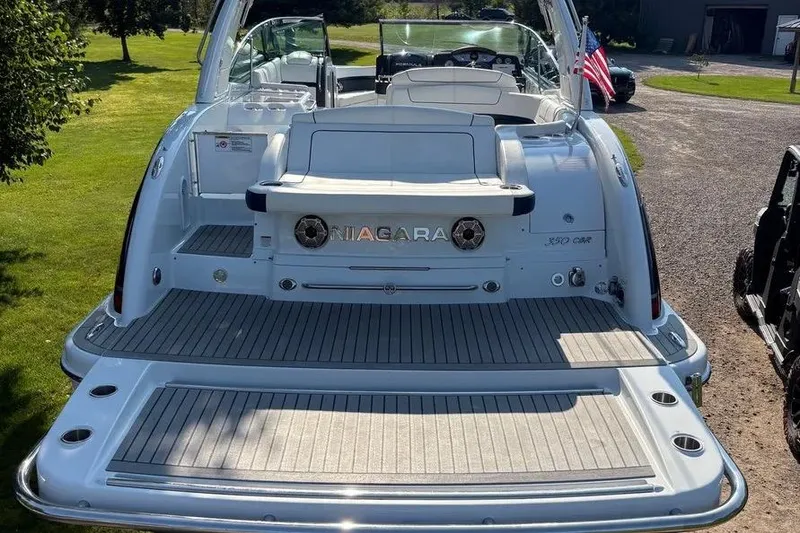 Slide: The Image of 2015 Formula 350 Crossover Bowrider boat with spacious deck and sleek design. - 13