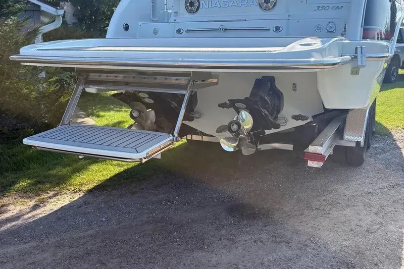 Slide: The Image of 2015 Formula 350 Crossover Bowrider boat rear view with propellers and swim platform. - 14