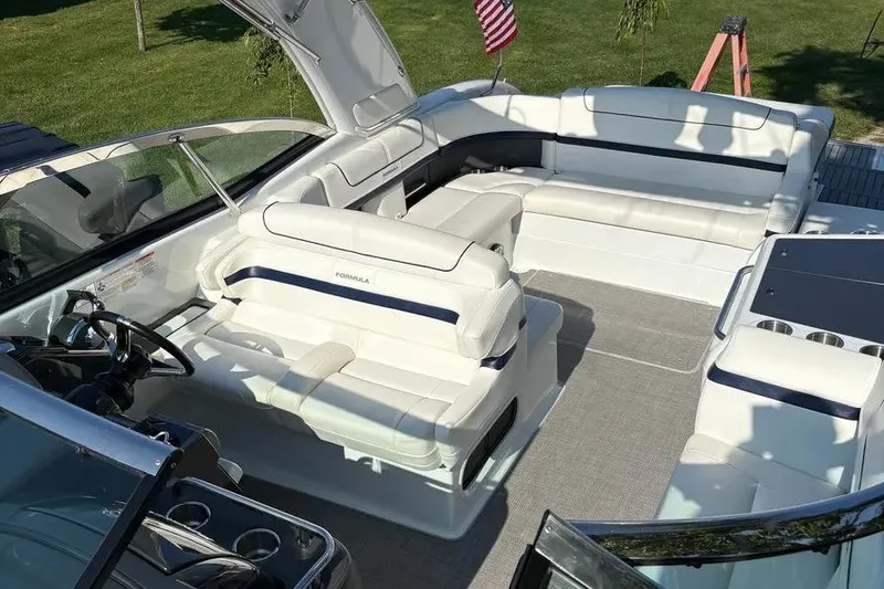 Slide: The Image of 2015 Formula 350 Crossover Bowrider with spacious white seating and sleek design. - 15