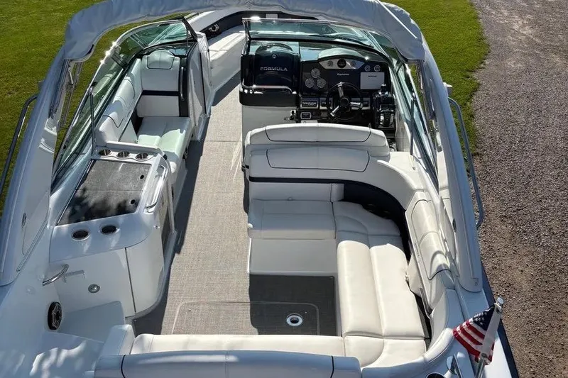 Slide: The Image of 2015 Formula 350 Crossover Bowrider interior with luxurious seating and helm. - 23