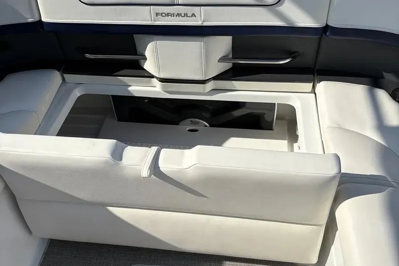 Slide: The Image of 2015 Formula 350 Crossover Bowrider interior seating with storage compartment open. - 25