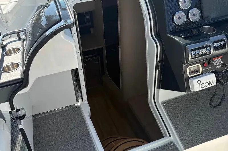Slide: The Image of 2015 Formula 350 Crossover Bowrider interior with control panel and cabin entrance. - 34