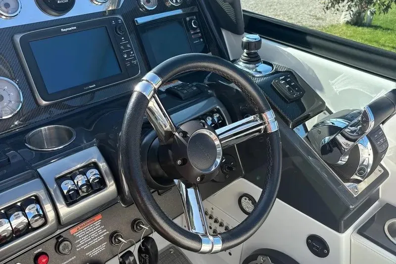 Slide: The Image of 2015 Formula 350 Crossover Bowrider dashboard with steering wheel and navigation controls. - 35