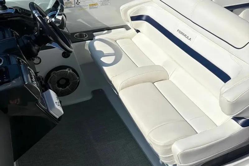 Slide: The Image of 2015 Formula 350 Crossover Bowrider interior with white leather seating and steering wheel. - 36