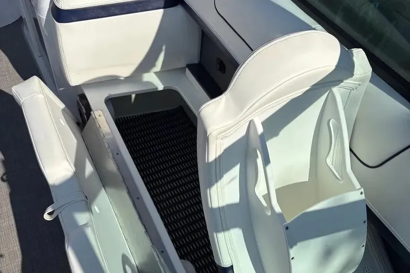Slide: The Image of 2015 Formula 350 Crossover Bowrider interior with white seating and storage compartment. - 39