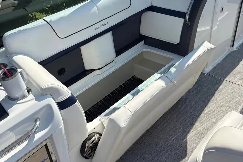 Slide: The Image of 2015 Formula 350 Crossover Bowrider with open storage compartment and cup holder. - 41