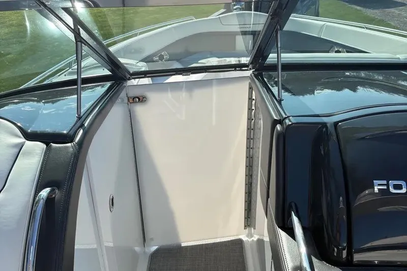 Slide: The Image of 2015 Formula 350 Crossover Bowrider interior with open windshield and sleek design. - 42
