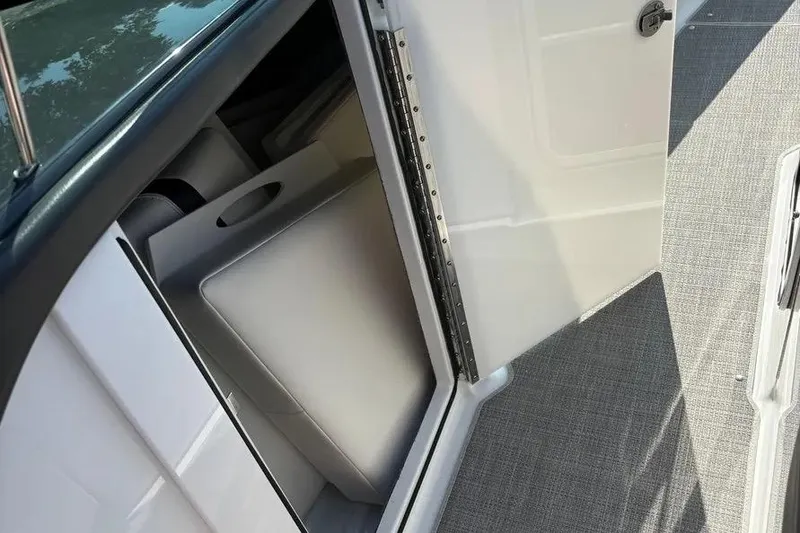 Slide: The Image of 2015 Formula 350 Crossover Bowrider cabin door open, revealing interior storage space. - 43