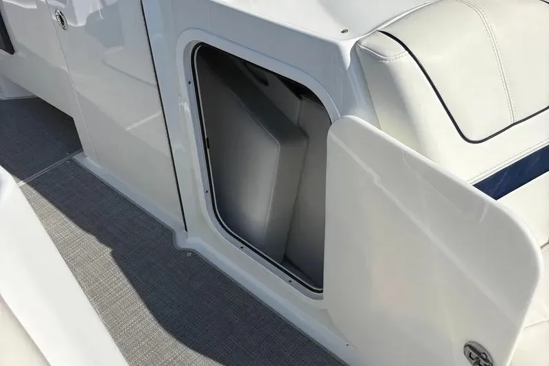 Slide: The Image of 2015 Formula 350 Crossover Bowrider storage compartment with open door, showcasing interior space. - 44