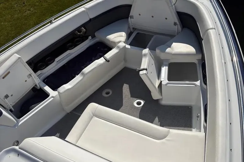 Slide: The Image of 2015 Formula 350 Crossover Bowrider interior with white seating and storage compartments. - 48