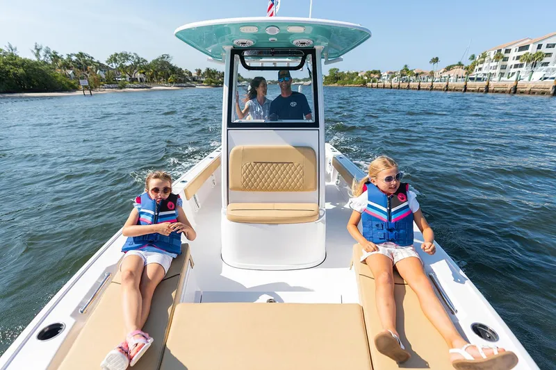 Slide: The Image of Manufacturer Provided Image: 2025 Sportsman Masters 227 Bay Boat cruising with family on sunny day. - 4