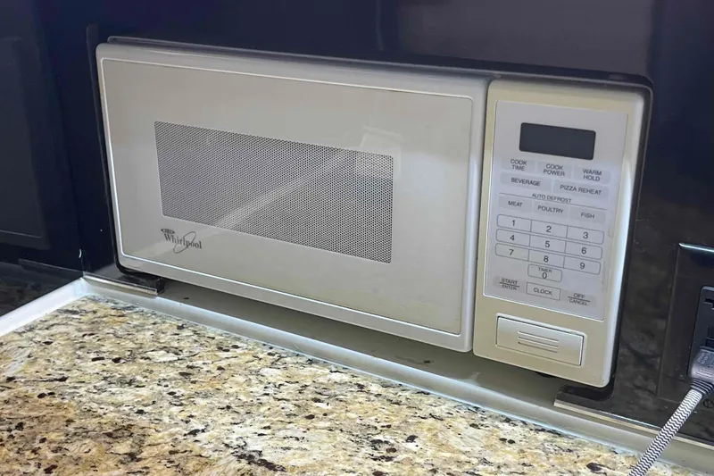 Slide: The Image of Built-in Whirlpool microwave in 1989 Sea Ray 380 Aft Cabin yacht kitchen. - 14