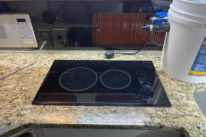 Slide: The Image of Kenyon cooktop on granite countertop in 1989 Sea Ray 380 Aft Cabin kitchen. - 15