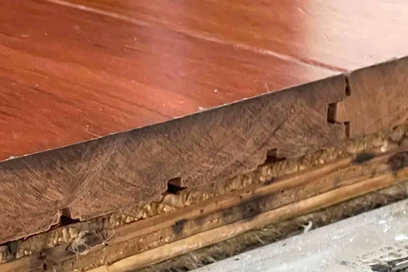 Slide: The Image of Close-up of wood flooring detail on 1989 Sea Ray 380 Aft Cabin boat. - 17