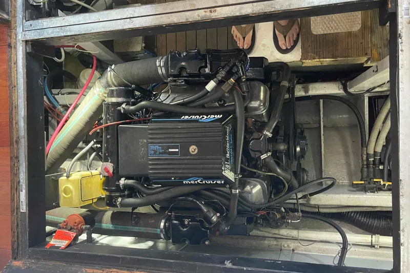 Slide: The Image of Engine compartment of a 1989 Sea Ray 380 Aft Cabin boat, featuring a MerCruiser engine. - 18