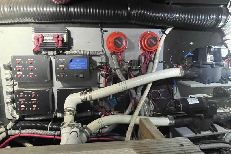 Slide: The Image of Engine room of 1989 Sea Ray 380 Aft Cabin with electrical panels and wiring. - 23