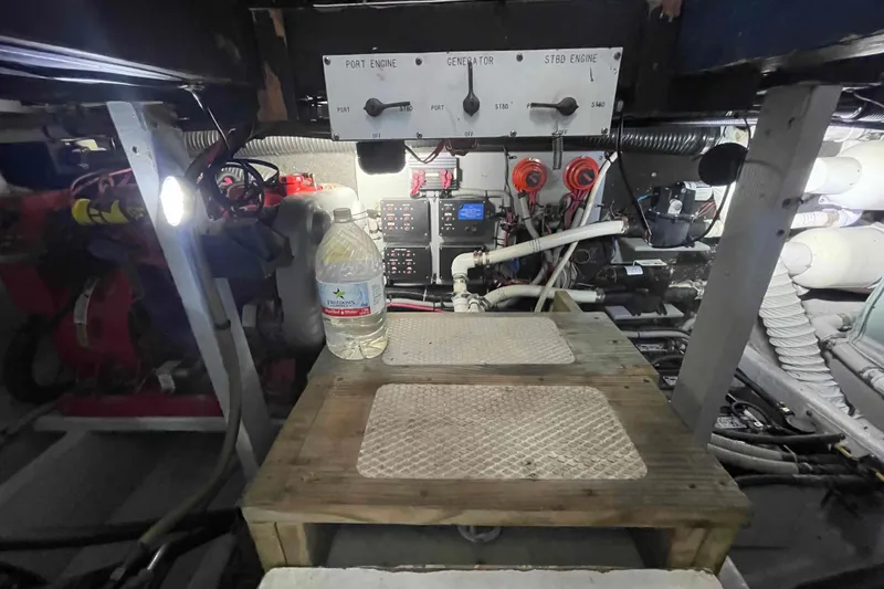 Slide: The Image of Engine room of a 1989 Sea Ray 380 Aft Cabin with control panel and equipment. - 24