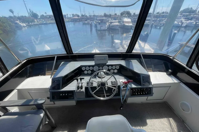 Slide: The Image of Cockpit view of 1989 Sea Ray 380 Aft Cabin yacht at marina. - 33