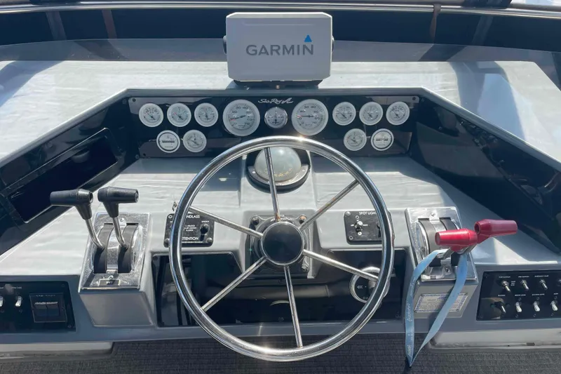 Slide: The Image of Helm of 1989 Sea Ray 380 Aft Cabin with Garmin navigation system and control panel. - 34