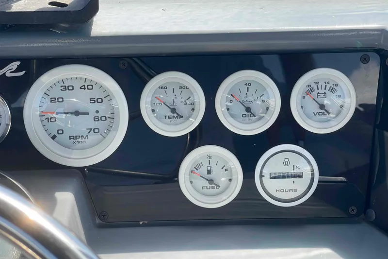 Slide: The Image of Dashboard gauges of a 1989 Sea Ray 380 Aft Cabin boat. - 39