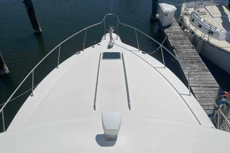 Slide: The Image of 1989 Sea Ray 380 Aft Cabin yacht docked at marina, top deck view. - 43