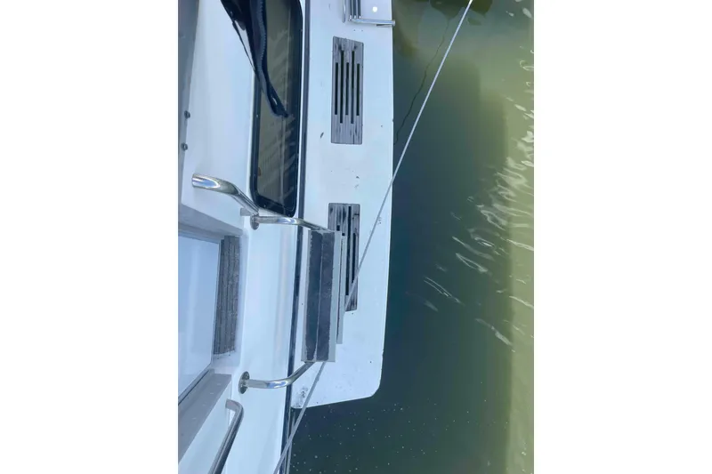 Slide: The Image of 1989 Sea Ray 380 Aft Cabin boat deck with water view. - 51