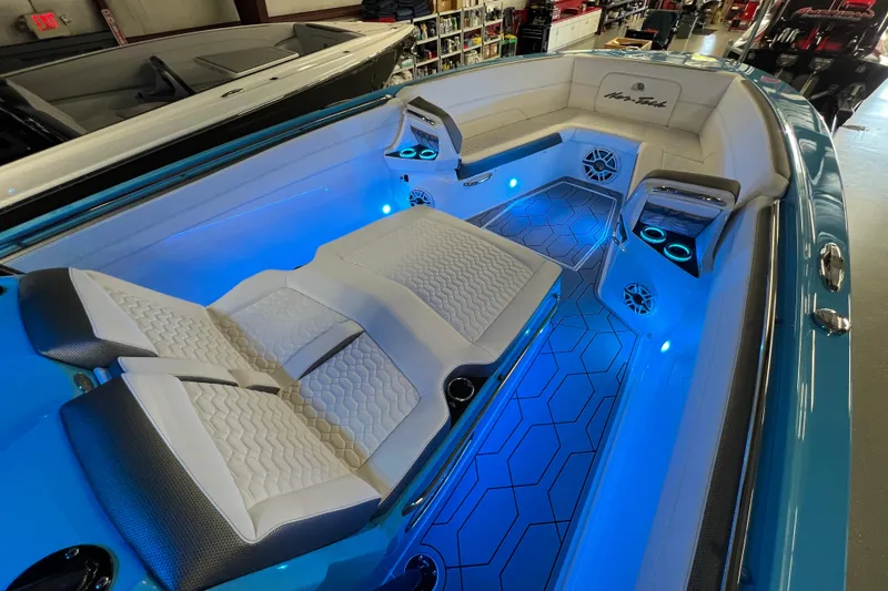 Slide: The Image of 2025 Nor-Tech 390 Sport Center Console with illuminated seating and modern interior design. - 11