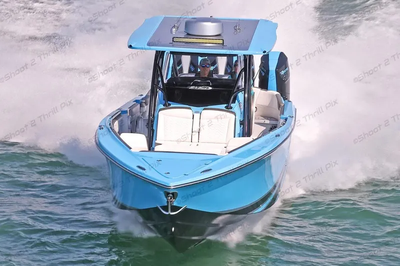 Slide: The Image of 2025 Nor-Tech 390 Sport Center Console speeding on water, showcasing sleek design and performance. - 4
