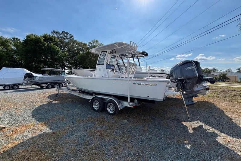 Slide: The Image of 2027 Sportsman Masters 247OE Bay Boat on trailer, parked outdoors under clear sky. - 17