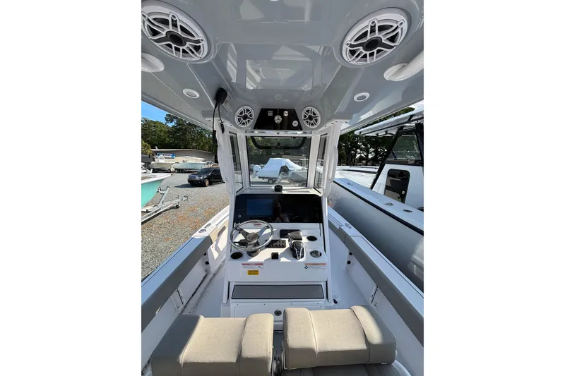 Slide: The Image of Interior view of 2027 Sportsman Masters 247OE Bay Boat with modern dashboard and seating. - 19