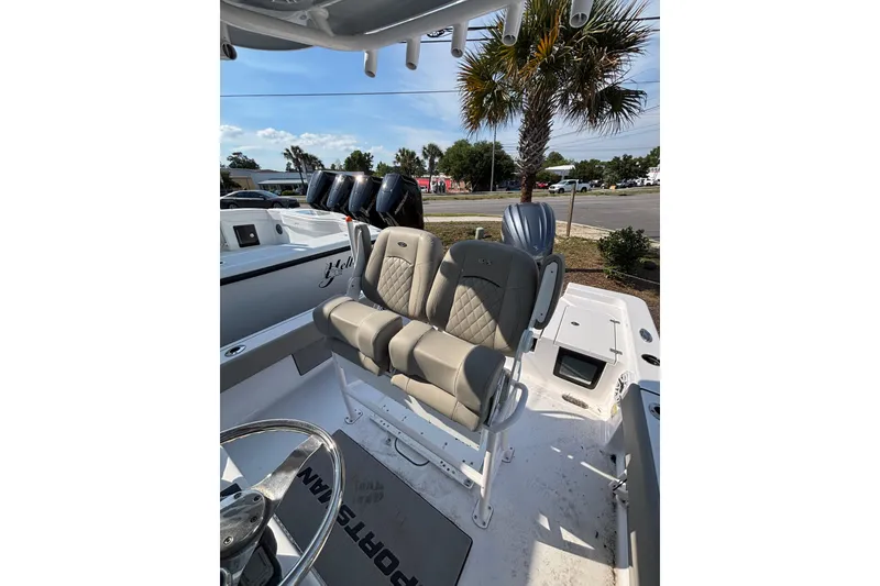 Slide: The Image of 2027 Sportsman Masters 247OE Bay Boat interior with dual seats and steering wheel. - 22