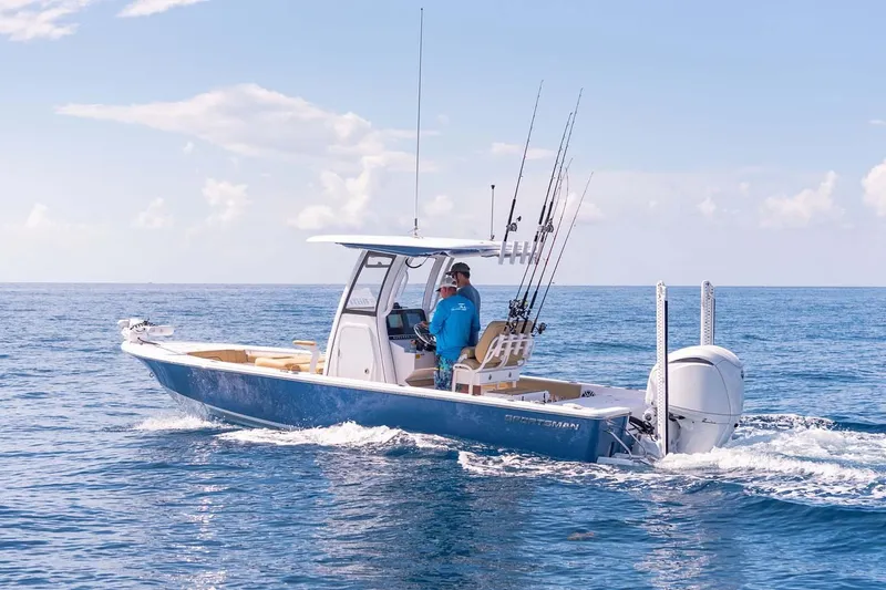 Slide: The Image of Manufacturer Provided Image: 2025 Sportsman Masters 247OE Bay Boat cruising on open water. - 2