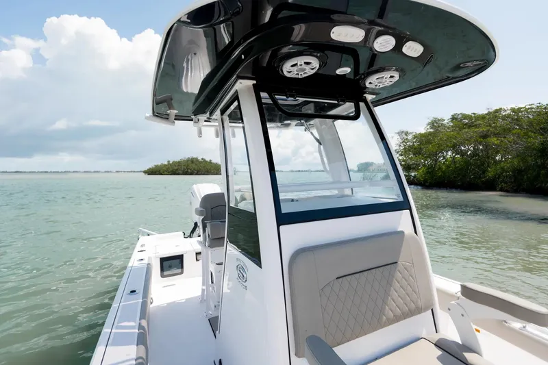 Slide: The Image of Manufacturer Provided Image: 2025 Sportsman Masters 247OE Bay Boat on calm water, featuring sleek design and modern amenities. - 8