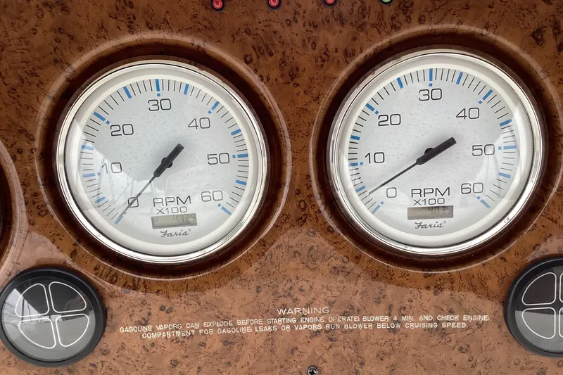 Slide: The Image of Raymarine Tridata display and gauges on 2006 Silverton 38 Sport Bridge dashboard. - 12