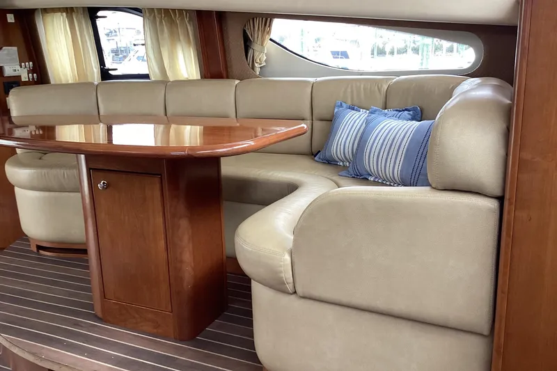 Slide: The Image of Luxurious interior of 2006 Silverton 38 Sport Bridge with beige leather sofa. - 17