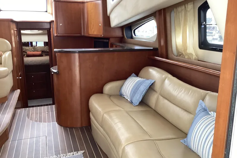 Slide: The Image of Entertainment setup in a 2006 Silverton 38 Sport Bridge yacht interior. - 20
