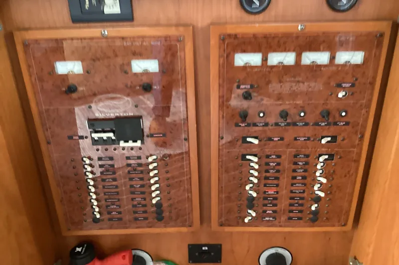 Slide: The Image of Luxurious 2006 Silverton 38 Sport Bridge yacht interior with modern kitchen and wood cabinetry. - 22