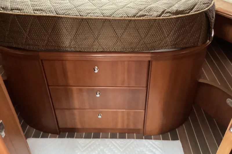 Slide: The Image of Luxurious bathroom in 2006 Silverton 38 Sport Bridge yacht with wood cabinetry and modern fixtures. - 26