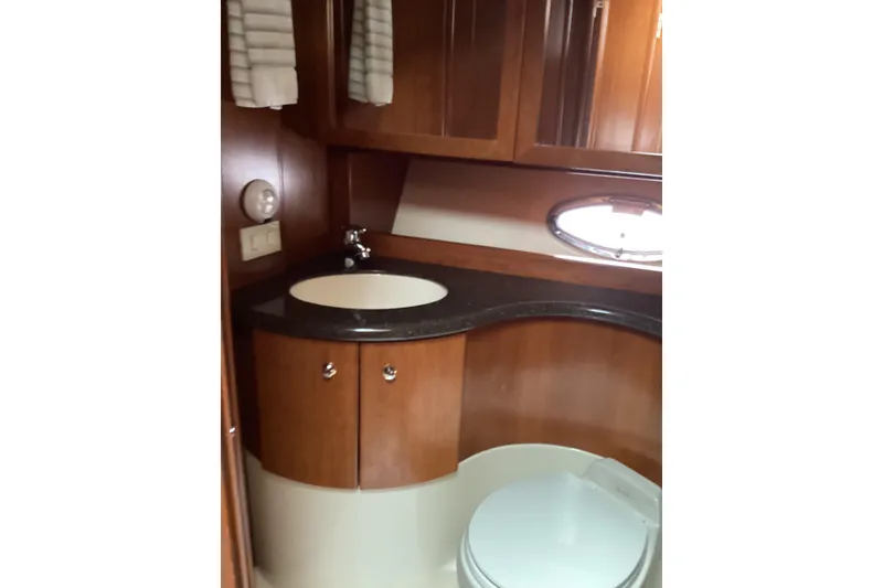 Slide: The Image of 2006 Silverton 38 Sport Bridge battery compartment with filtration system. - 34