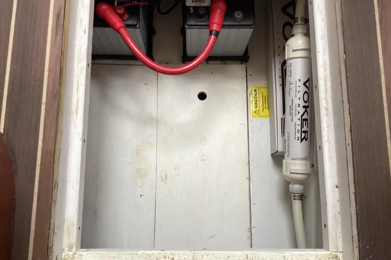 Slide: The Image of Engine compartment of a 2006 Silverton 38 Sport Bridge, featuring a blue engine component. - 36