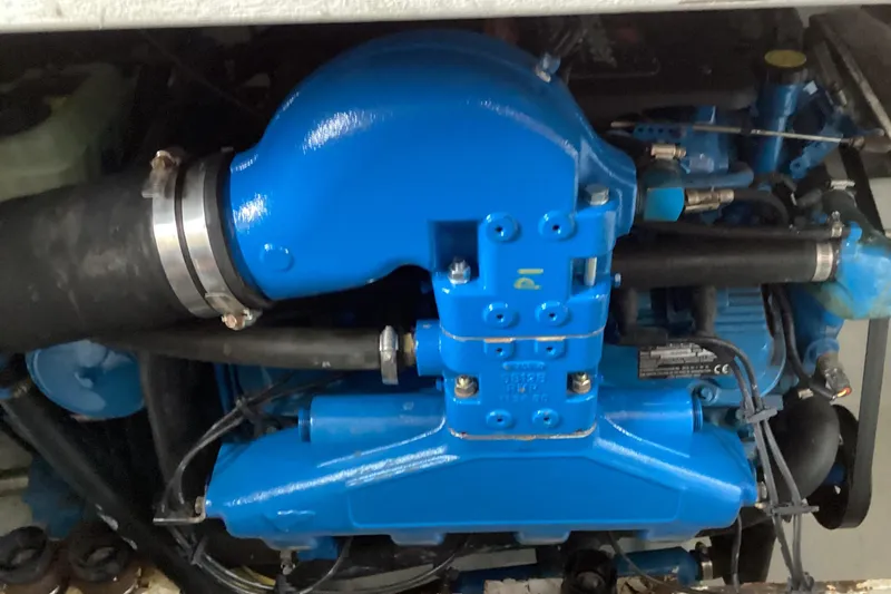 Slide: The Image of Interior cabin of 2006 Silverton 38 Sport Bridge with twin beds and wooden finish. - 39