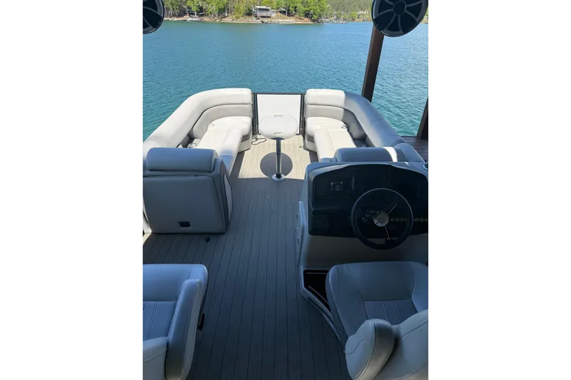 Slide: The Image of 2022 Bentley Pontoons Elite 253 Swingback interior with luxurious seating on a serene lake. - 3