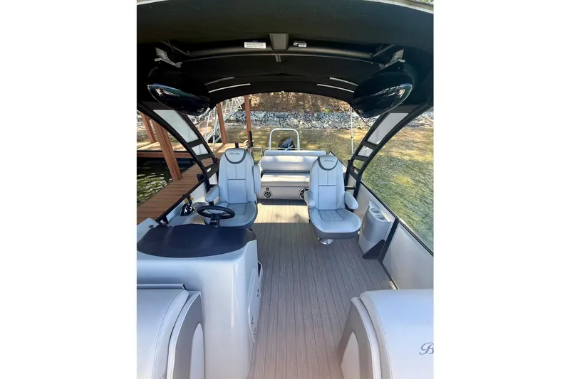 Slide: The Image of 2022 Bentley Pontoons Elite 253 Swingback interior with luxurious seating and modern design. - 5