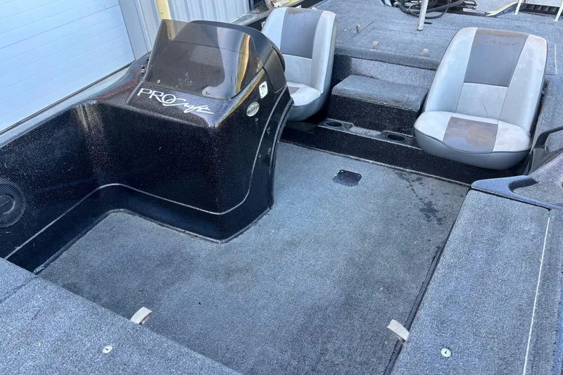 Slide: The Image of 1995 ProCraft V-180 boat interior with dual seats and steering console. - 6