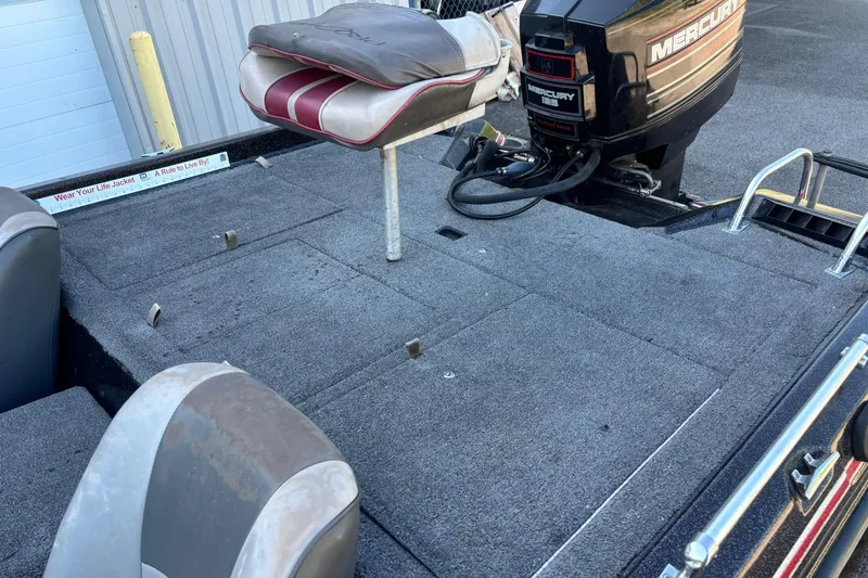 Slide: The Image of 1995 ProCraft V-180 boat deck with Mercury outboard motor and seating. - 7