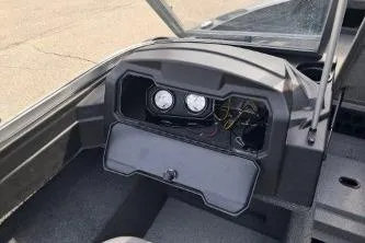 Slide: The Image of 2019 Crestliner 1850 Fish Hawk WT dashboard with gauges and storage compartment. - 10