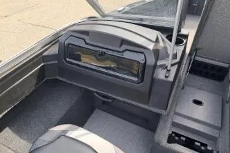 Slide: The Image of 2019 Crestliner 1850 Fish Hawk WT boat interior with dashboard and seating. - 11