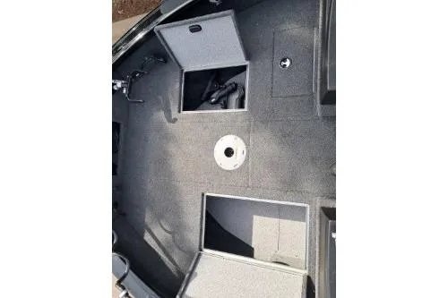 Slide: The Image of 2019 Crestliner 1850 Fish Hawk WT boat interior with open storage compartments. - 8