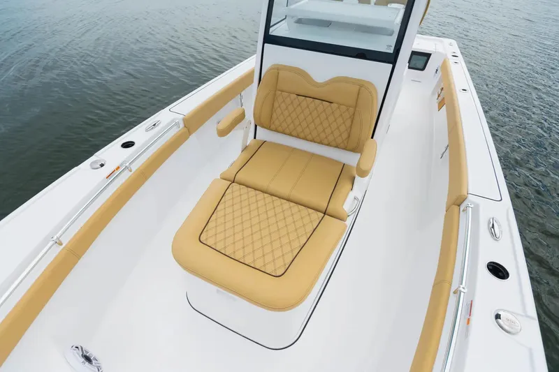 Slide: The Image of Manufacturer Provided Image: 2025 Sportsman Masters 267OE Bay Boat with tan seating on calm water. - 5