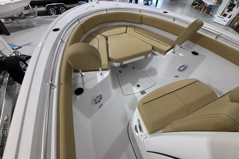 Slide: The Image of 2027 Sportsman Heritage 231 Center Console boat interior with tan seating and modern design. - 19